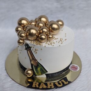 Champagne Bottle Cake with Gold Balls by Bakeology, Gwalior