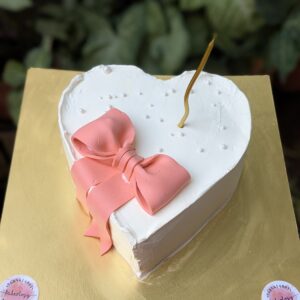 Heart Cake with Peach Bow by Bakeology, Gwalior