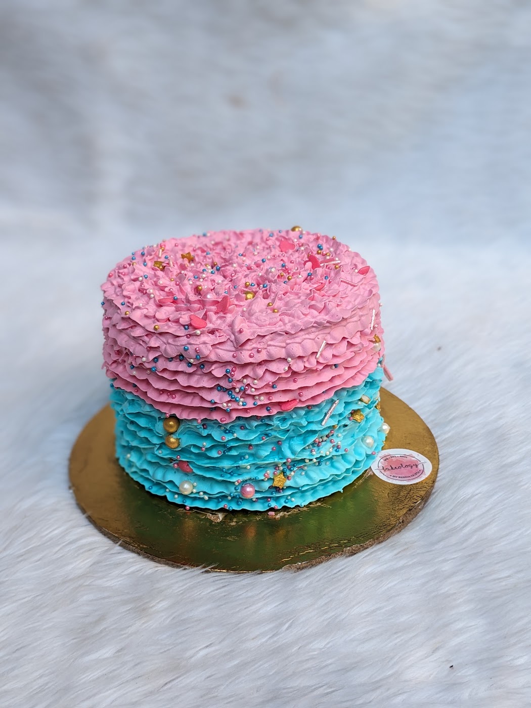 Pink and Blue Ruffle Gender Reveal Cake by Bakeology, Gwalior